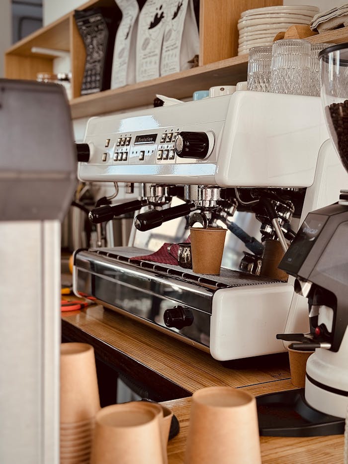 about-01 Stylish coffee shop in Kyiv with a modern espresso machine and takeaway cups. Perfect for café culture visuals.